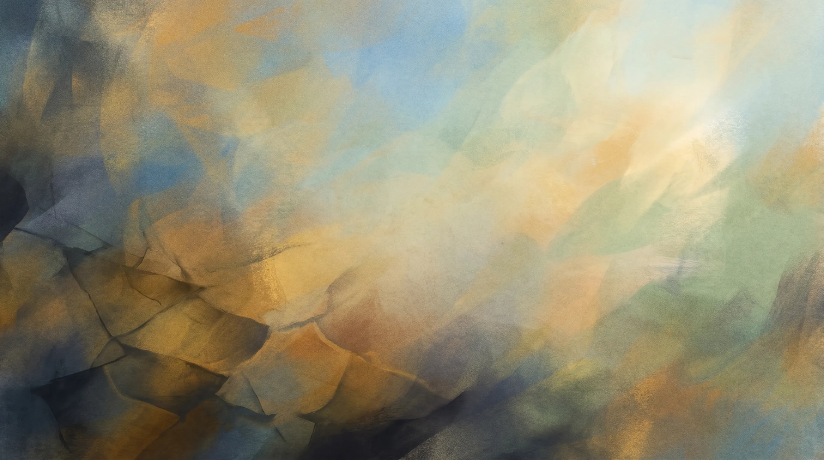 An abstract wash of warm gold and blue, light breaking through from the upper right like dawn over a faceted landscape.